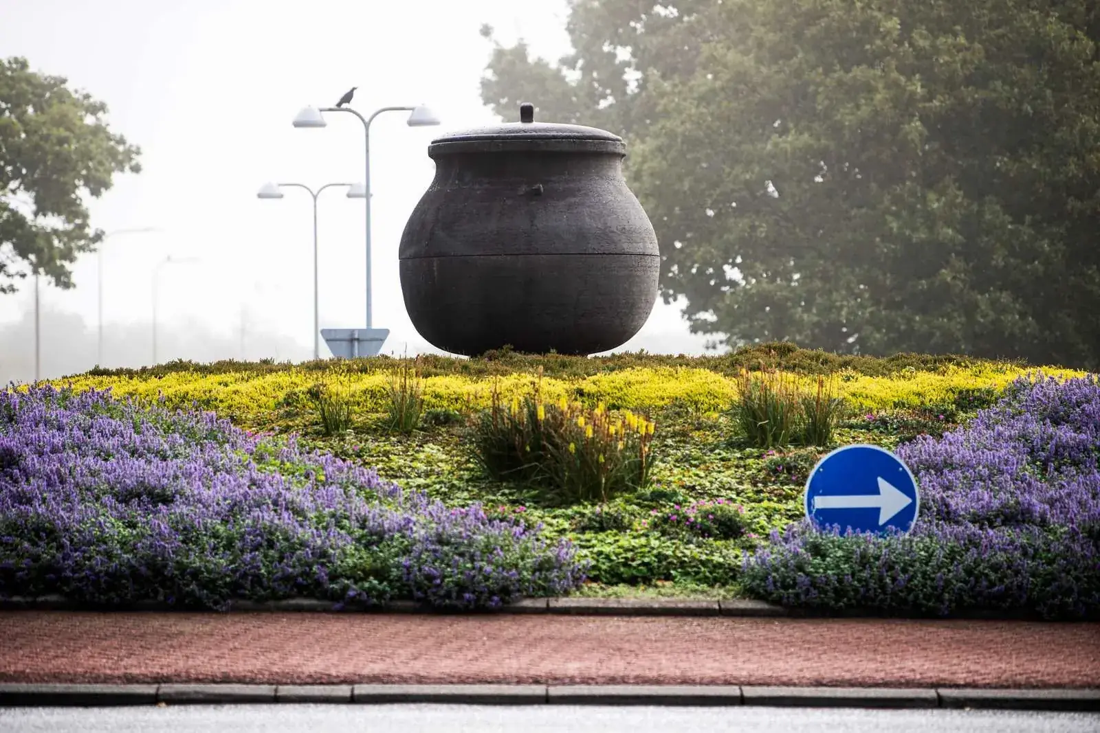 The Jydepotten sculpture in a flowering roundabout in Grindsted